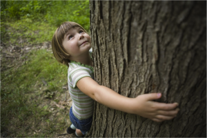 girl hugging tree